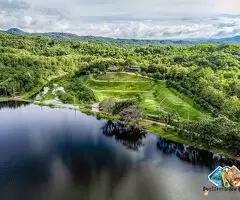 The Best Feng Shui House For Sale, surrounded by reservoir and mountains.